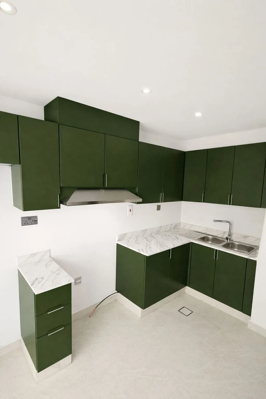 Dark green vinyl wrapped kitchen cabinets Dubai