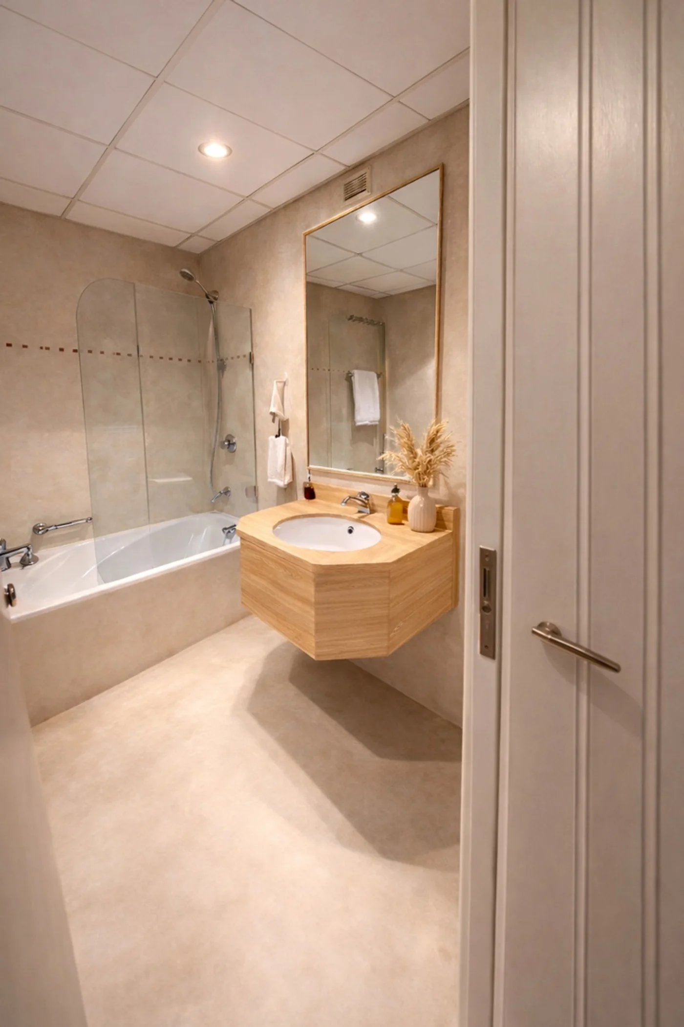 Bathroom wrapped in sandy beige vinyl with wood vanity Dubai