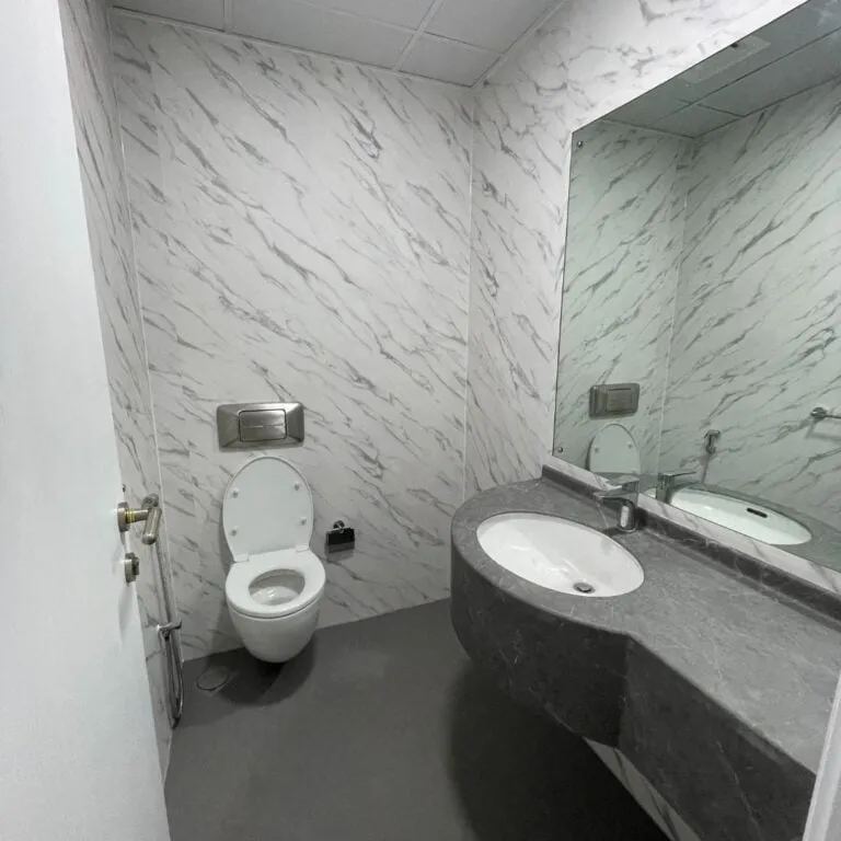 Bathroom vanity wrapped in light grey vinyl Dubai