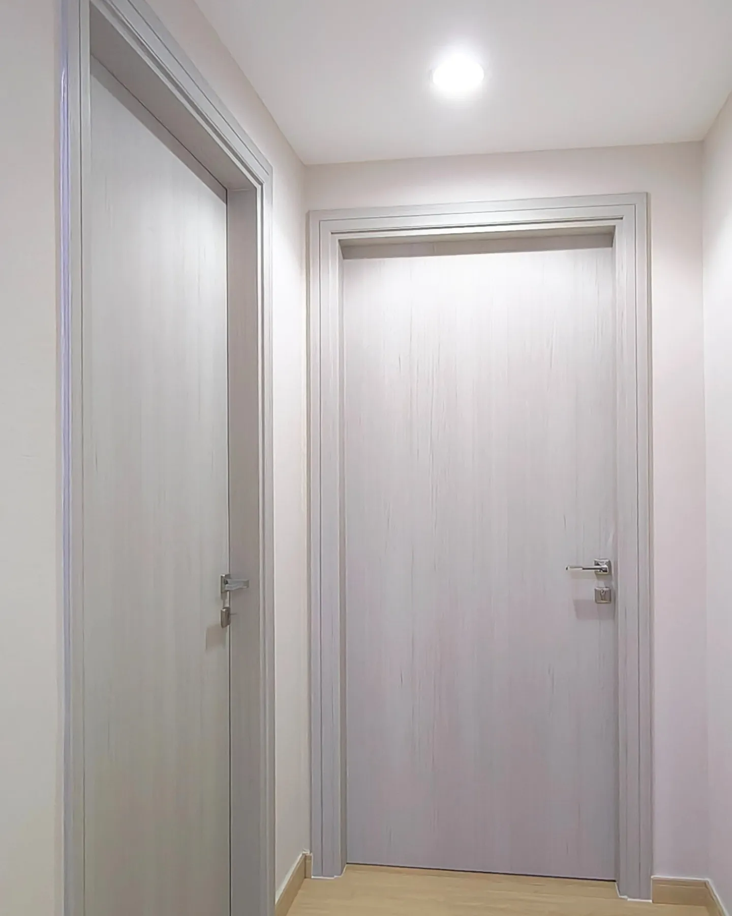 Grey wood-grain doors and frames wrapped in vinyl Dubai