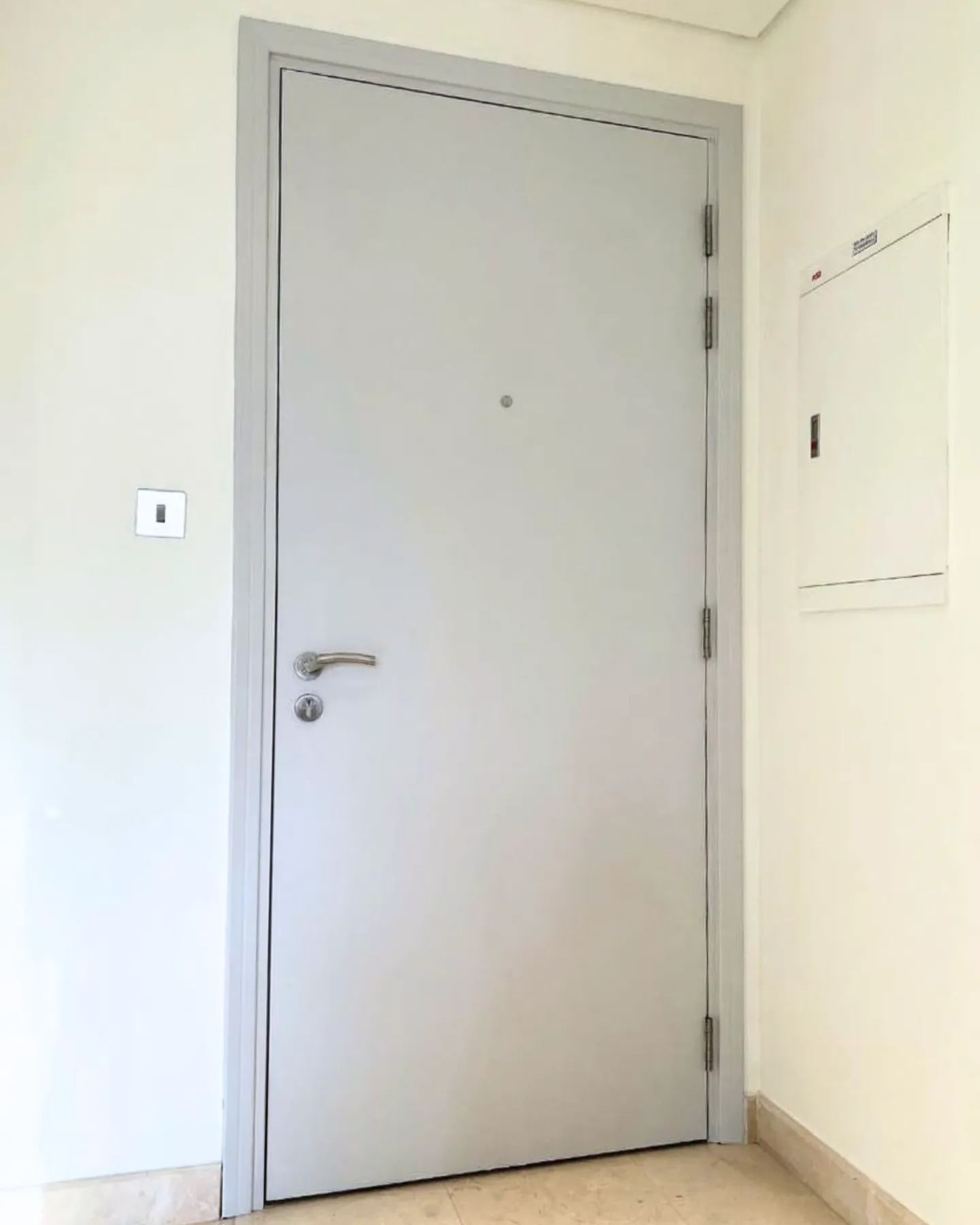 Entrance door wrapped in grey vinyl Dubai